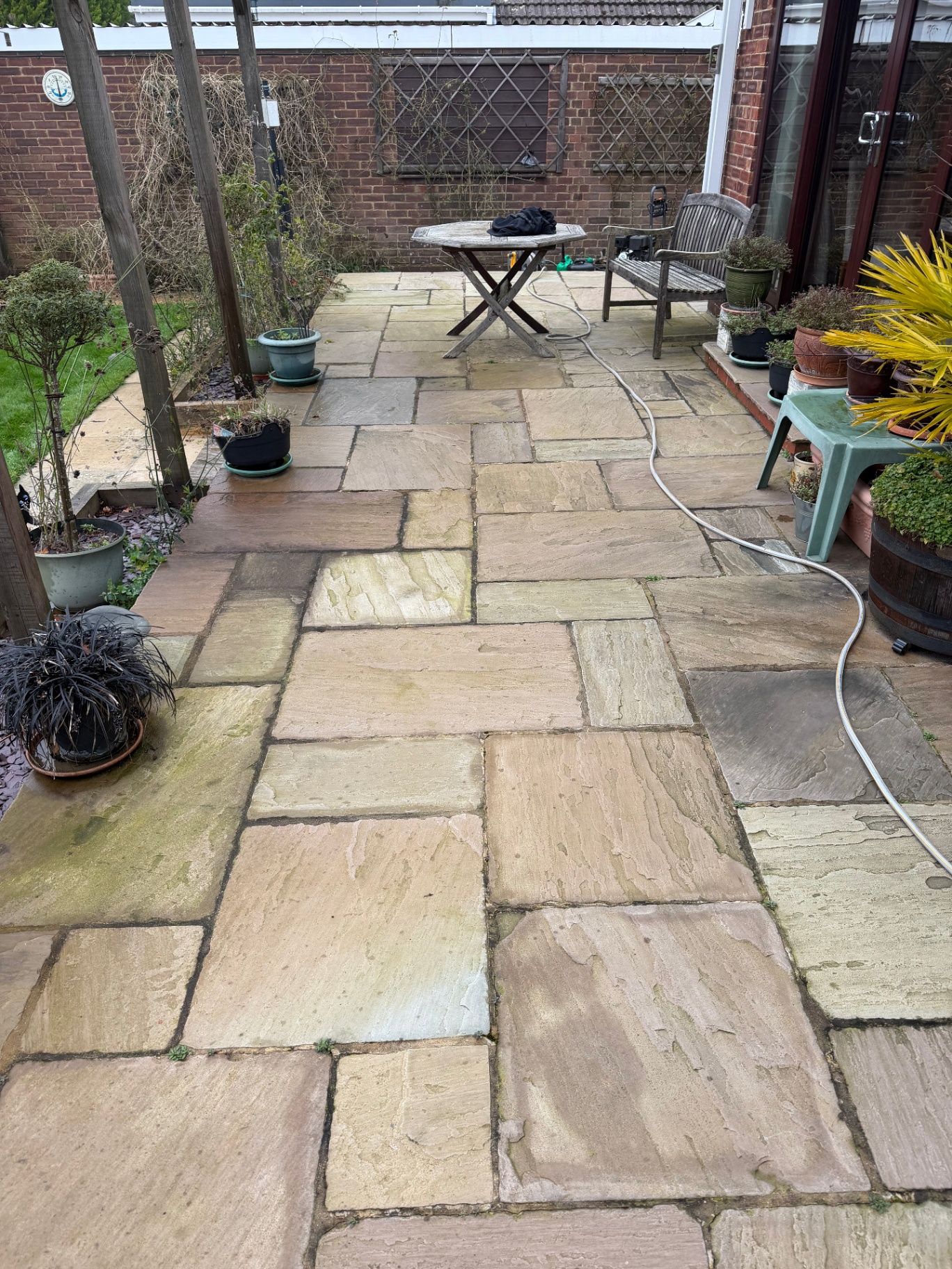 Sandstone patio before cleaning