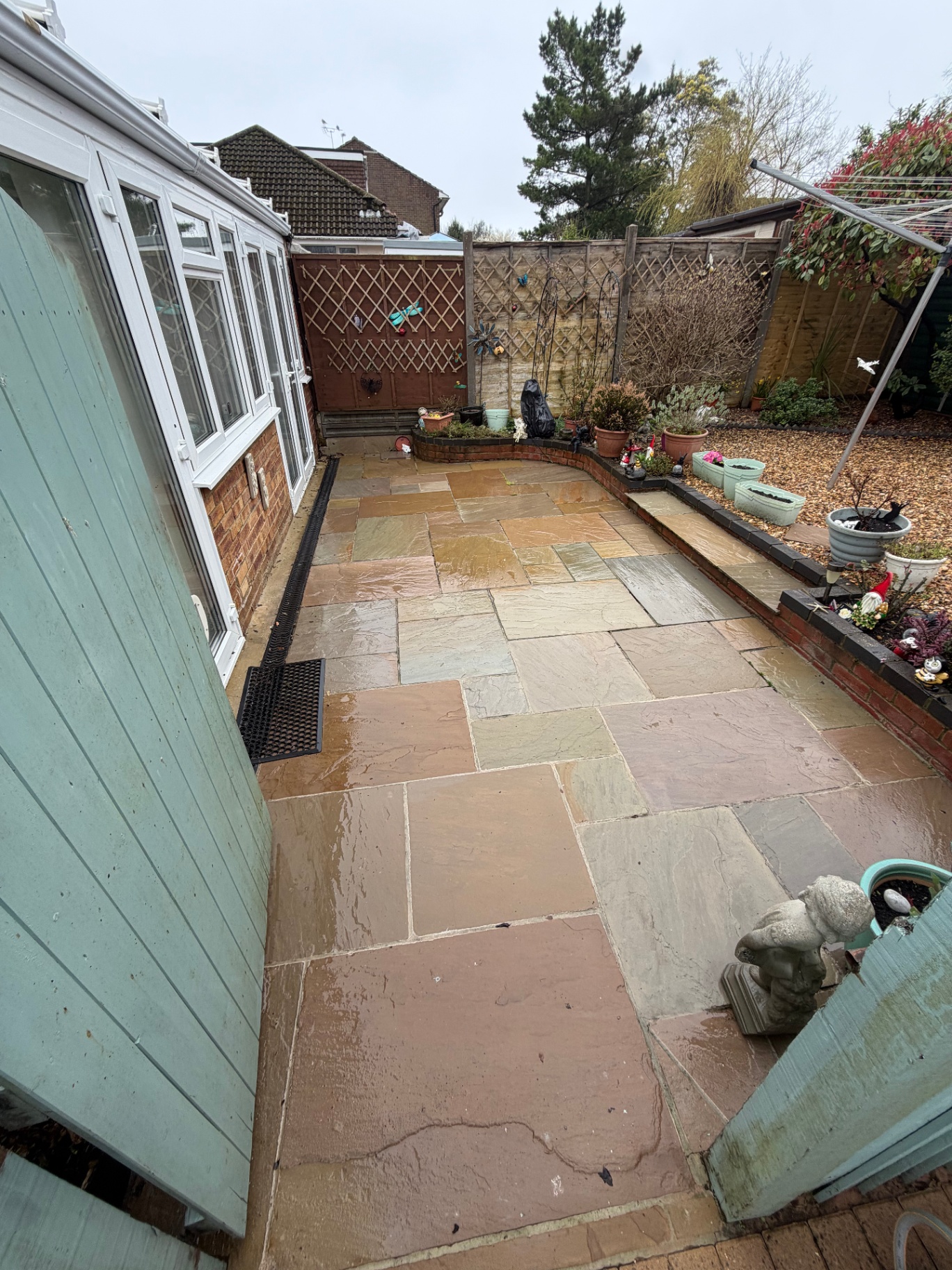 Indian sandstone patio beside conservatory after cleaning