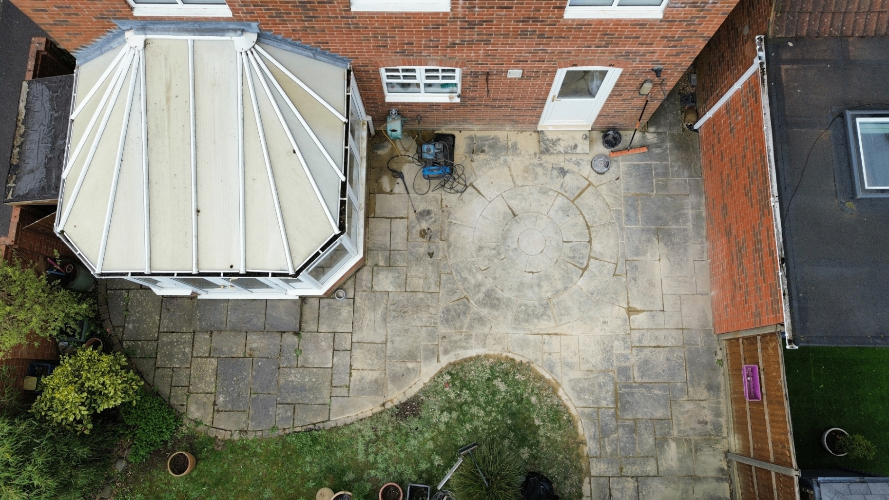 Aerial patio and conservatory view before cleaning